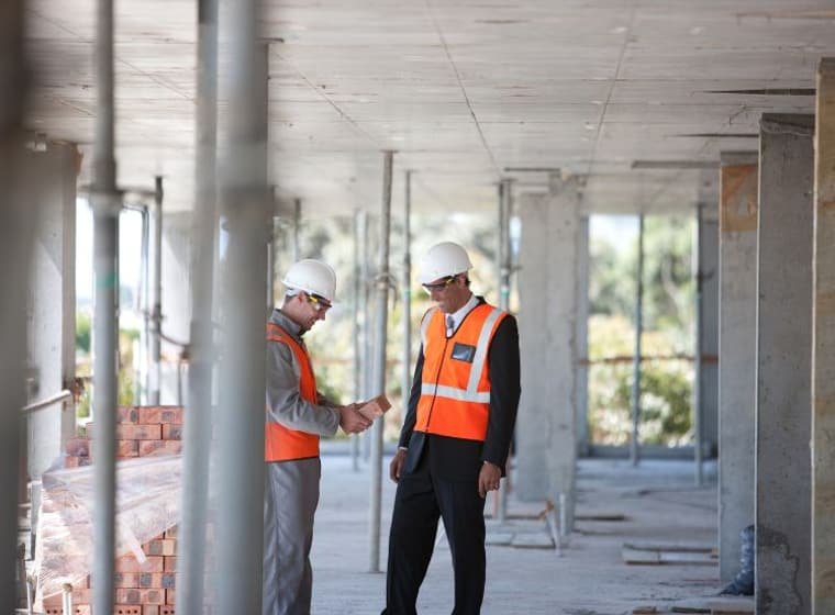 Client and manager reviewing the finished handover on site