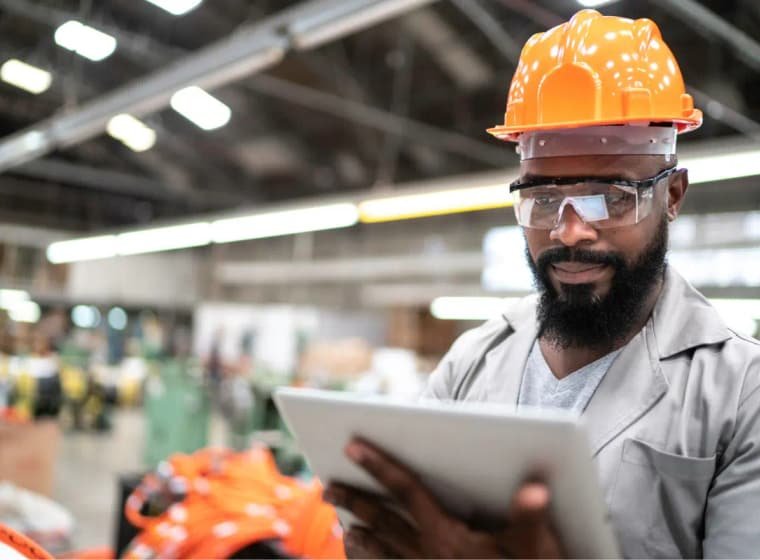Site engineer checking live progress on a tablet